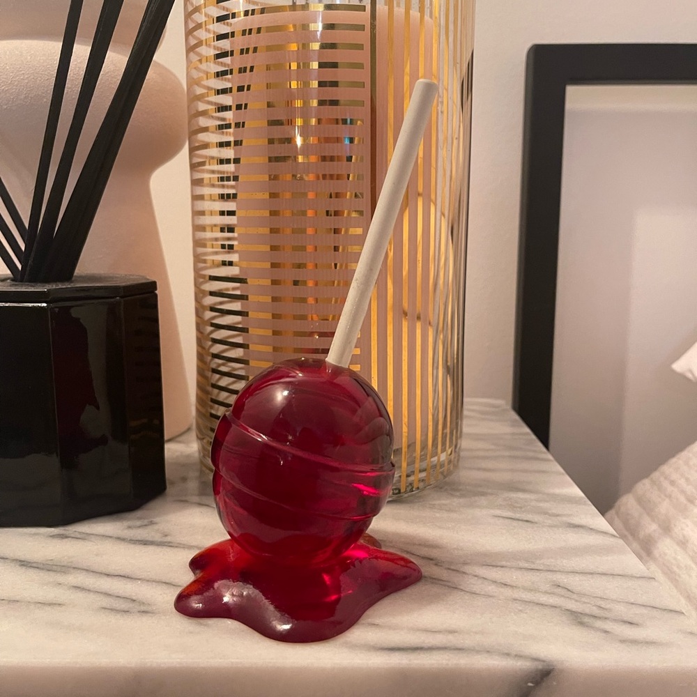 Mini red resin lollipop sculpture